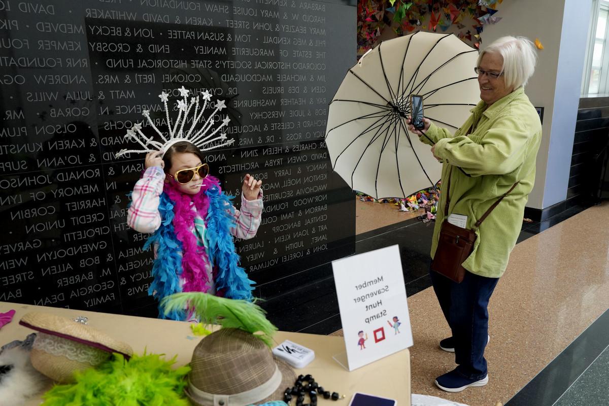 Pat Haggett, left, watches and assists her granddaughter, Phoenix Sikes, 9, on May 11 during Family Adventure Day at the FAC. Children and adults alike watched puppetry, created art and played dress up, while walking through a variety of Bemis School of Art instructors’ booths and displays. Photo by Jamie Cotten / Colorado College